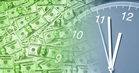 Clock on assorted American banknotes. Time is money ideaの写真素材