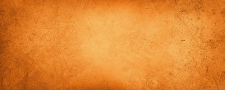 Orange textured concrete wall backgroundの写真素材