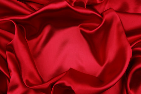 Closeup of rippled red silk fabricの写真素材