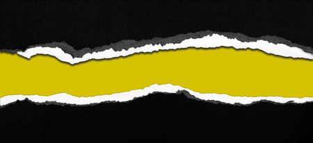 Ripped black paper on yellow background, space for copyの写真素材
