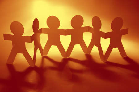 Paper chain team holding hands. Teamwork. Partnershipの写真素材