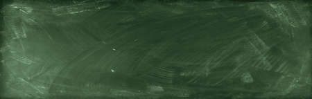Chalk rubbed out on green chalkboard backgroundの写真素材