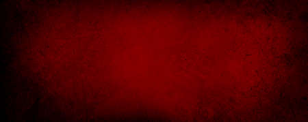 Red textured concrete wall grunge backgroundの写真素材