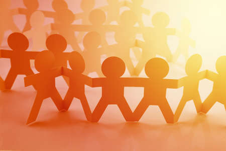 Group of paper chain people united togetherの写真素材