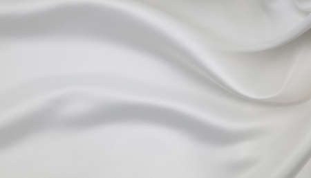 Close-up of rippled white silk fabric texture backgroundの写真素材