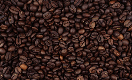 Close-up of roasted brown coffee beans backgroundの写真素材