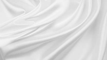 Close-up of rippled white silk fabric texture backgroundの写真素材