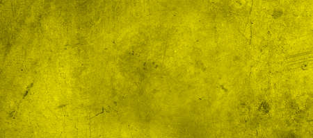 Yellow textured concrete wall wide backgroundの写真素材