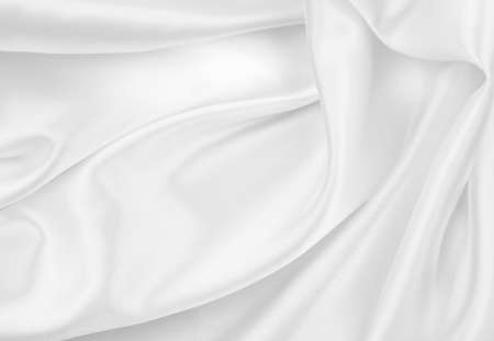 Close-up of rippled white silk fabric texture backgroundの写真素材