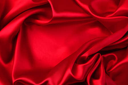 Closeup of rippled red silk fabricの写真素材