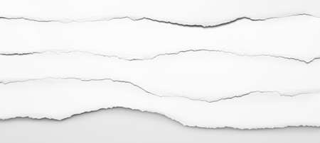 Ripped white paper edges backgroundの写真素材