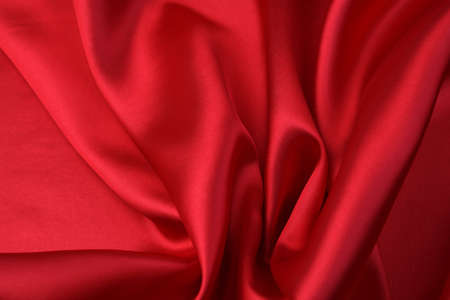 Closeup of rippled red silk fabricの写真素材