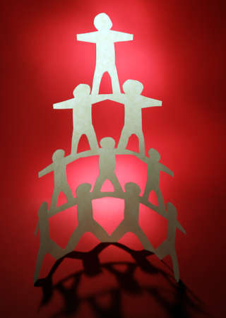 Human team pyramid supporting each otherの写真素材
