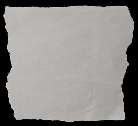 Piece of torn paper on blackの写真素材