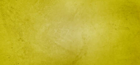 Yellow textured concrete wall wide backgroundの写真素材