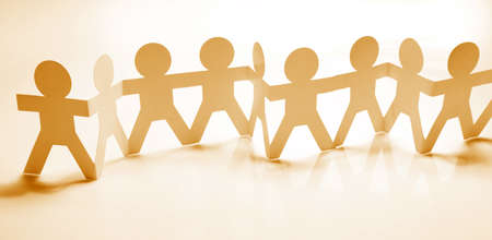 Paper chain team holding hands. Teamwork. Partnershipの写真素材