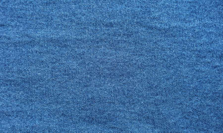 Close-up of blue denim jeans fabric texture backgroundの写真素材