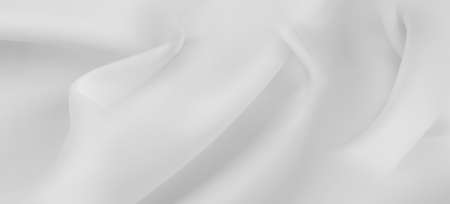 Close-up of rippled white silk fabric texture backgroundの写真素材
