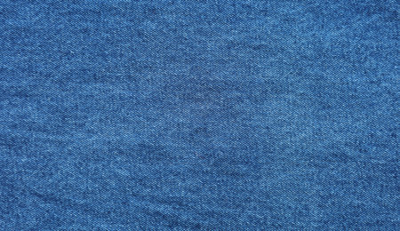 Close-up of blue denim jeans fabric texture backgroundの写真素材