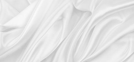 Rippled white silk fabric texture backgroundの写真素材