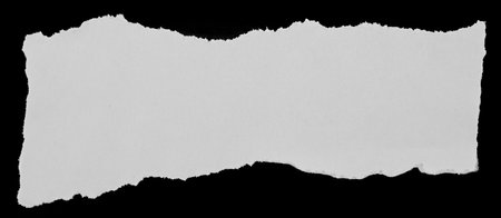 Piece of torn paper on blackの写真素材