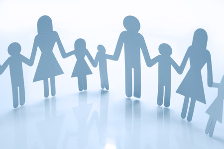 Family paper chain cutout holding handsの写真素材