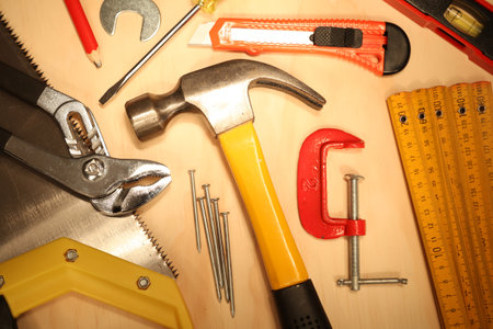 Assorted work tools on woodの写真素材