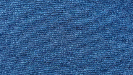 Close-up of blue denim jeans fabric texture backgroundの写真素材