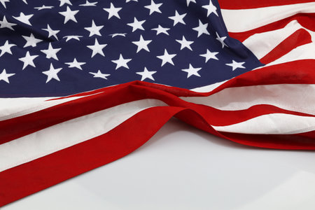 Closeup of American flag on white backgroundの写真素材