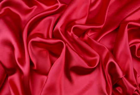 Closeup of rippled red silk fabricの写真素材