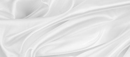 Rippled white silk fabric texture backgroundの写真素材