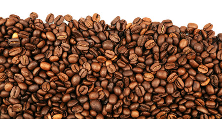 Closeup of roasted brown coffee beans on plain backgroundの写真素材