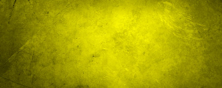 Yellow textured concrete wall wide backgroundの写真素材