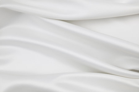 Rippled white silk fabric texture backgroundの写真素材