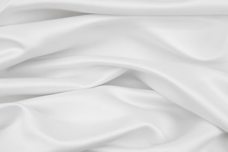 Rippled white silk fabric texture backgroundの写真素材
