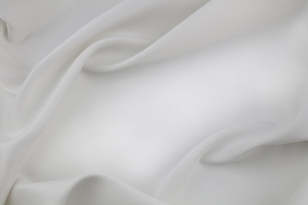Rippled white silk fabric texture backgroundの写真素材