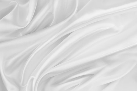 Rippled white silk fabric texture backgroundの写真素材