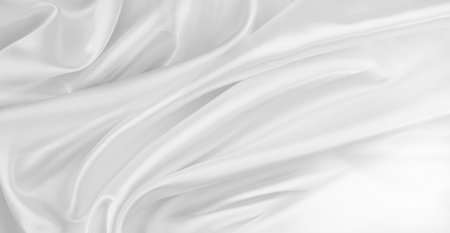 Rippled white silk fabric texture backgroundの写真素材