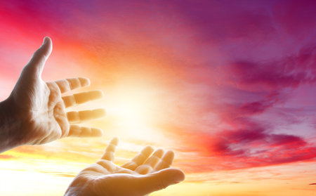 Open hands in the skyの写真素材
