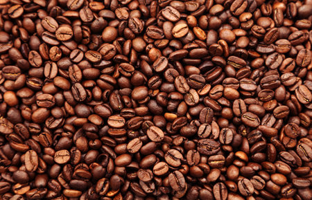 Close-up of roasted brown coffee beans backgroundの写真素材