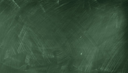 Chalk rubbed out on green chalkboard backgroundの写真素材