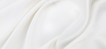 Rippled white silk fabric texture backgroundの写真素材