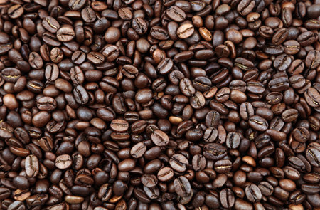 Close-up of roasted brown coffee beans backgroundの写真素材
