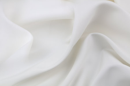 Rippled white silk fabric texture backgroundの写真素材