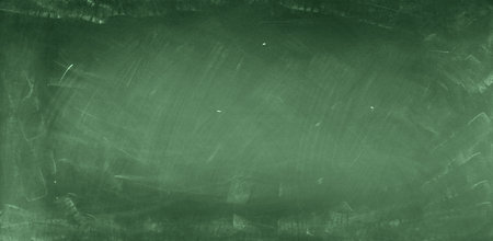 Chalk rubbed out on green chalkboard backgroundの写真素材