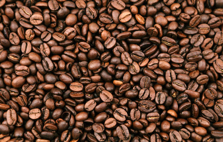 Close-up of roasted brown coffee beans backgroundの写真素材