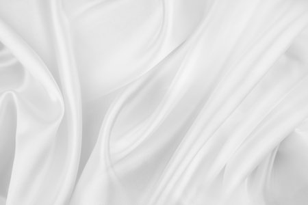 Rippled white silk fabric texture backgroundの写真素材
