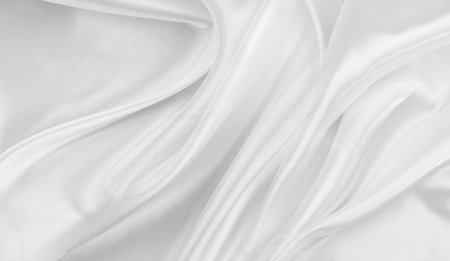 Rippled white silk fabric texture backgroundの写真素材