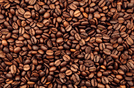 Close-up of roasted brown coffee beans backgroundの写真素材
