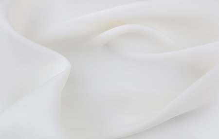 Rippled white silk fabric texture backgroundの写真素材